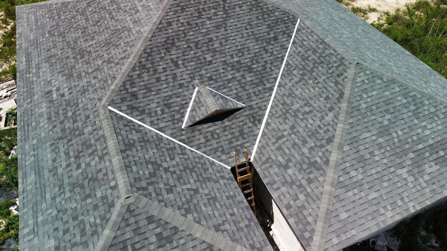 Close aerial of architectural shingle roof valleys